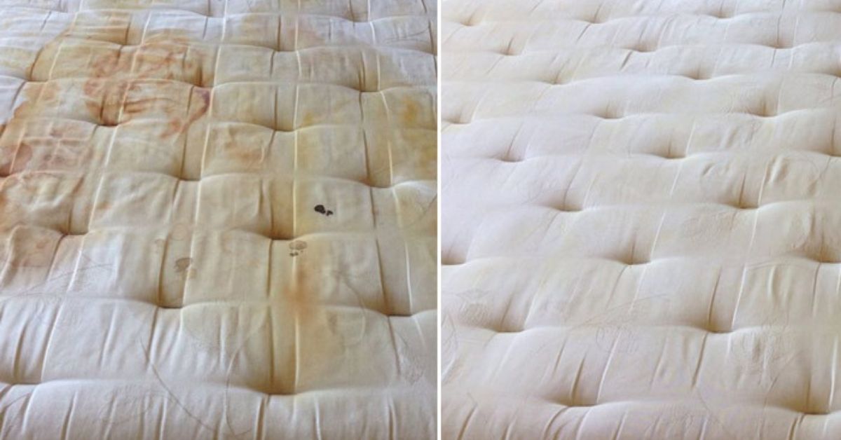 Mattress before cleaning — yellow sweat stains and discoloration visible