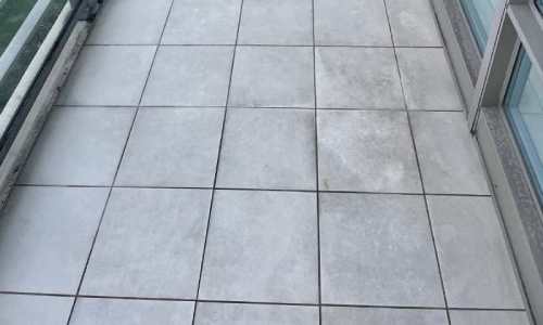 Office tile floor after professional cleaning — grout lines restored