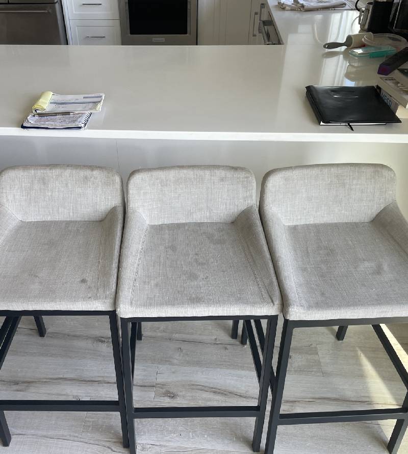 Upholstery before cleaning — visible dirt and staining